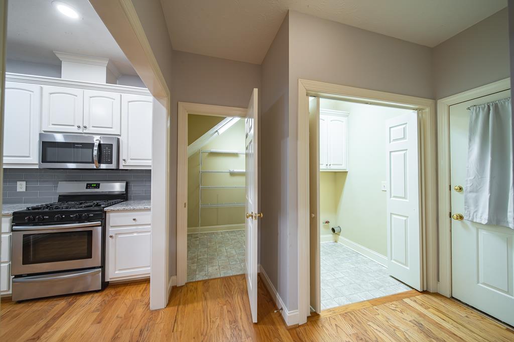 4571 Carnoustie Lane Columbus, GA 31909 - Photo 26 of 49 a kitchen with a refrigerator an oven and a sink