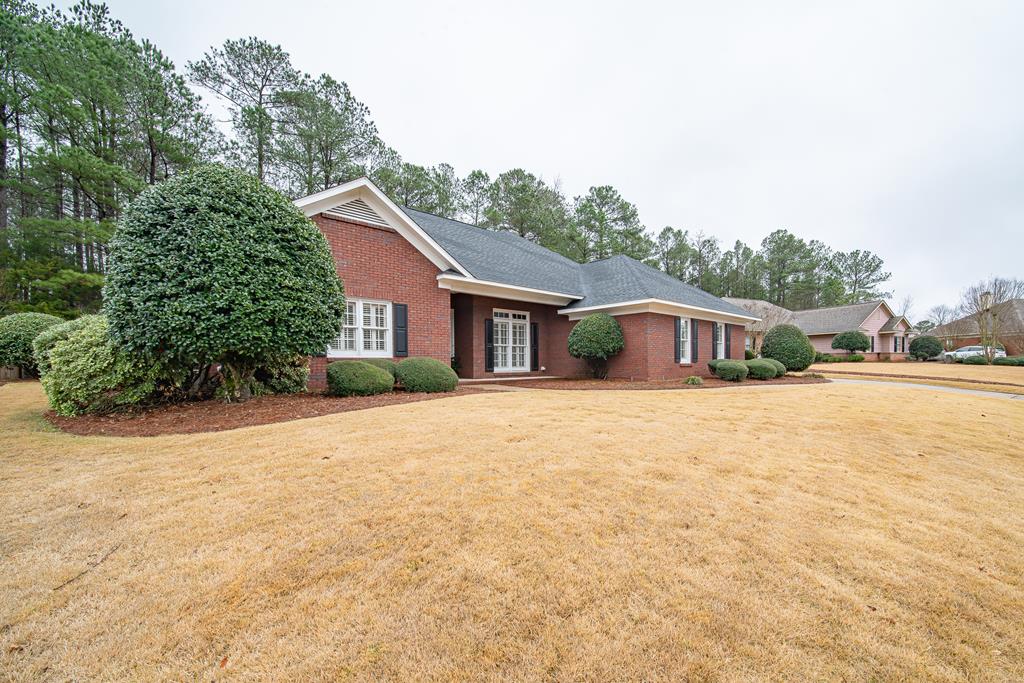 4571 Carnoustie Lane Columbus, GA 31909 - Photo 4 of 49 a front view of a house with a yard and garage