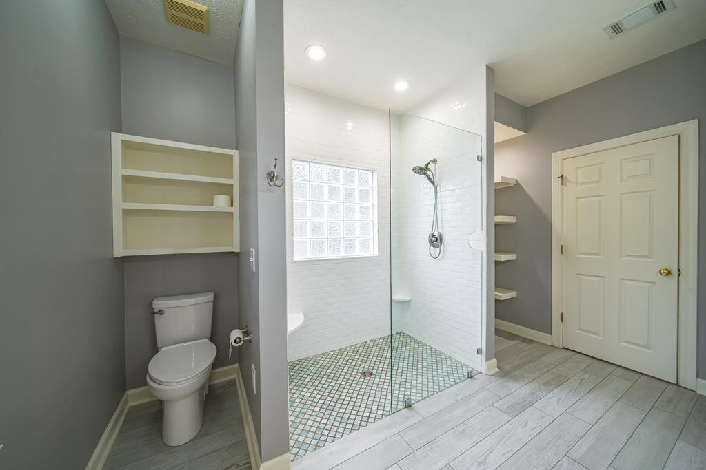 4571 Carnoustie Lane Columbus, GA 31909 - Photo 46 of 49 a bathroom with a shower toilet and sink