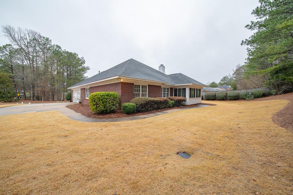 4571 Carnoustie Lane Columbus, GA 31909 - Photo 7 of 49 a front view of a house with a yard