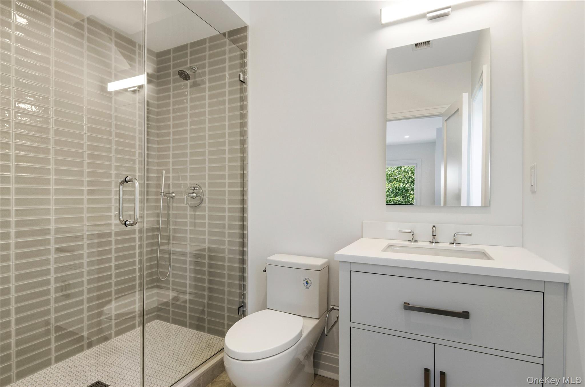 135 South Road Westhampton, NY 11977 - Photo 19 of 38 a bathroom with a sink toilet and shower
