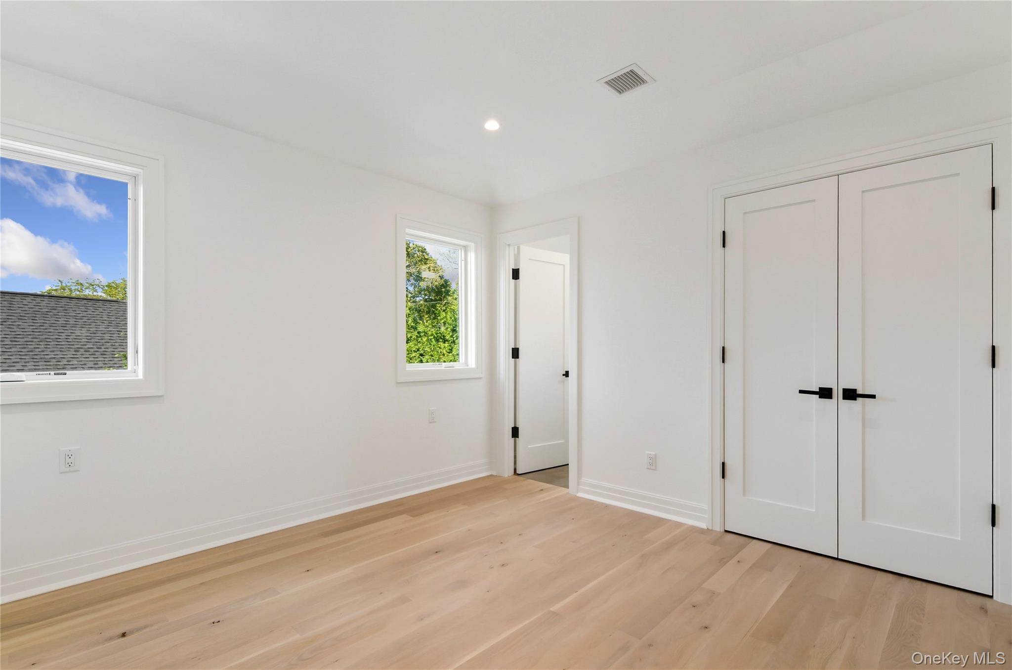 135 South Road Westhampton, NY 11977 - Photo 28 of 38 a view of an empty room with wooden floor and a window