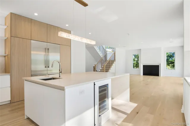 a kitchen with a sink and a refrigerator