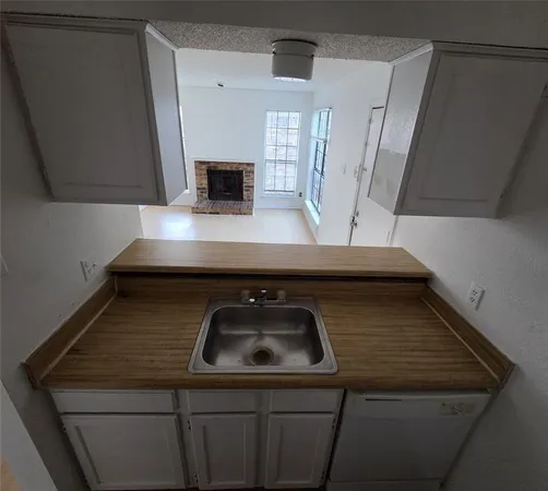 a kitchen with a stove and a sink