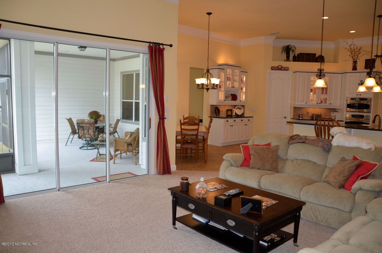 128 Puritan Road Ponte Vedra, FL 32081 - Photo 17 of 35 Family Room To Lanai & Kitchen
