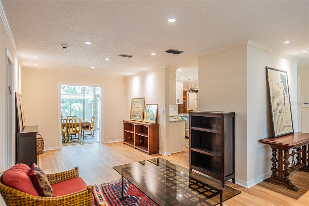 741 Brookside Road Maitland, FL 32751 - Photo 11 of 43 a living room with furniture a rug and kitchen view