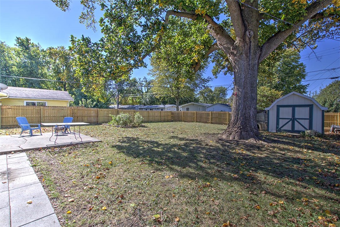 3959 Cambridge Drive Decatur, IL 62526 - Photo 15 of 20 Backyard with patio, garden, & shed