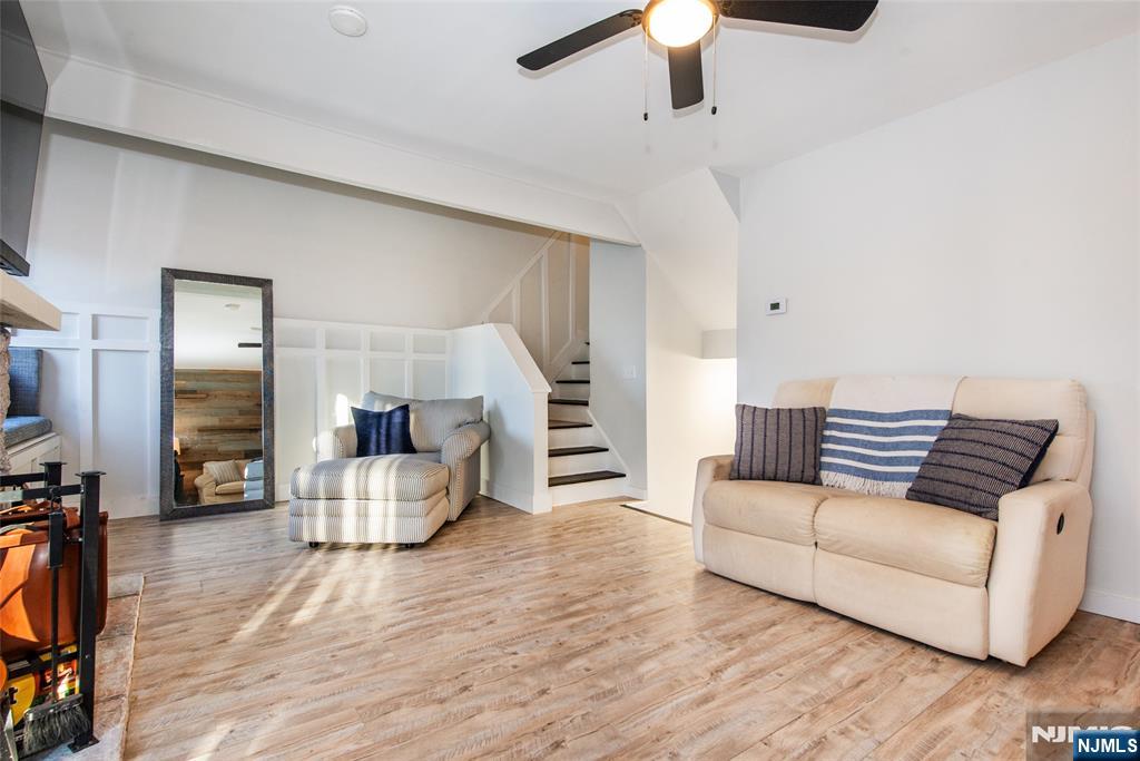 15 Village Way, Unit 5 Vernon, NJ 07462 - Photo 11 of 22 a living room with furniture and a wooden floor
