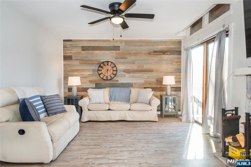 15 Village Way, Unit 5 Vernon, NJ 07462 - Photo 12 of 22 a living room with furniture and a wooden floor