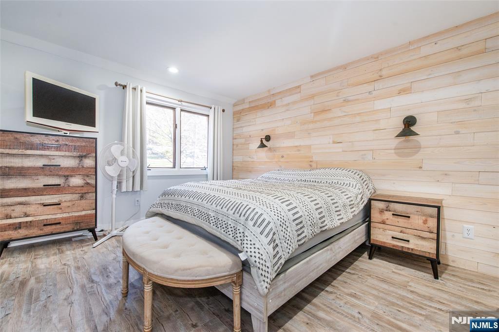 15 Village Way, Unit 5 Vernon, NJ 07462 - Photo 15 of 22 a bedroom with a bed and a flat screen tv