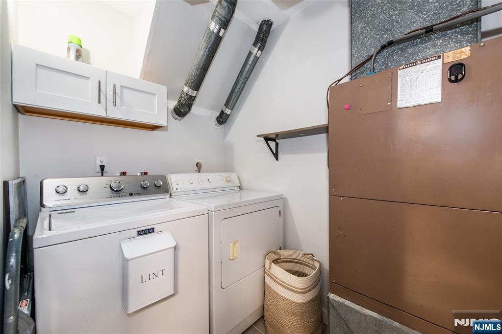 15 Village Way, Unit 5 Vernon, NJ 07462 - Photo 6 of 22 a utility room with dryer and washer