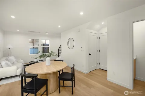 a view of a dining room with furniture and wooden floor