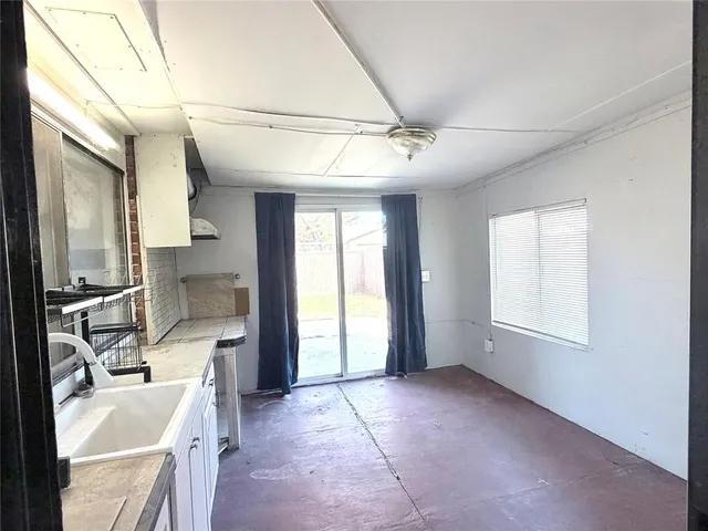 a view of a kitchen with furniture and a window