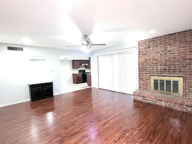 a view of a livingroom with wooden floor