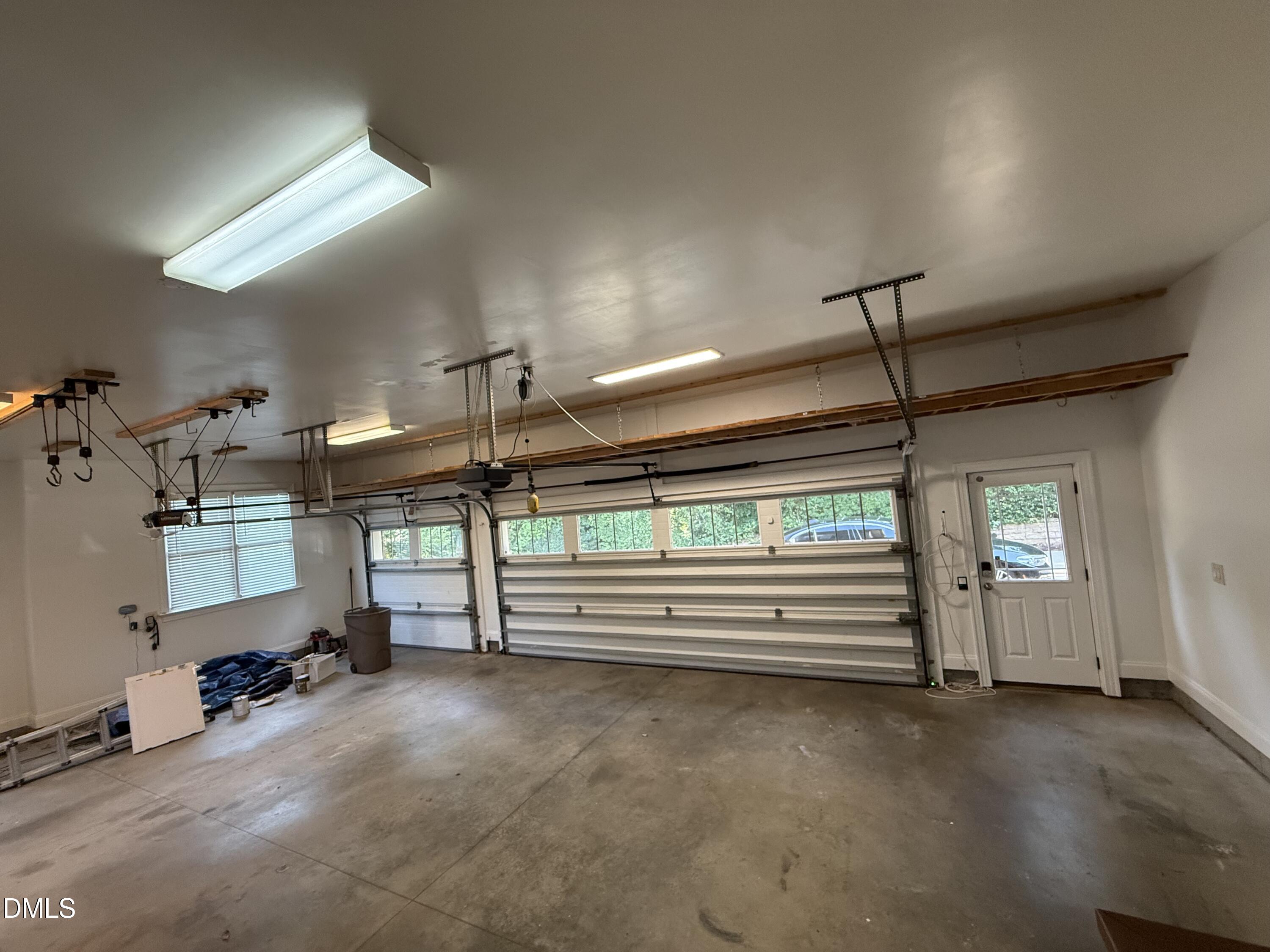 7324 Sparhawk Road Wake Forest, NC 27587 - Photo 65 of 74 Three car garage with storage above