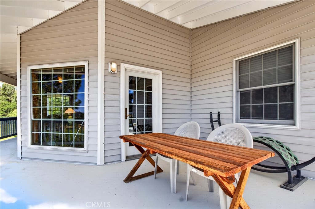 15185 Rancheria Creek Road Caliente, CA 93518 - Photo 18 of 54 a house that has a wooden bench in front of it