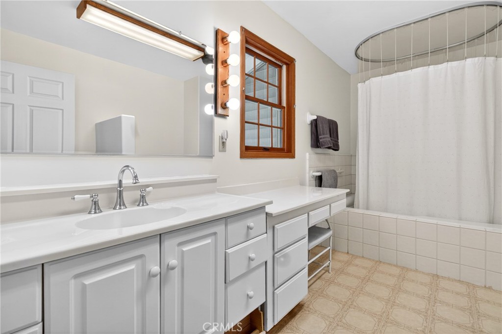 15185 Rancheria Creek Road Caliente, CA 93518 - Photo 24 of 54 a bathroom with a double vanity sink a mirror and a bathtub