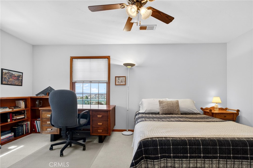 15185 Rancheria Creek Road Caliente, CA 93518 - Photo 30 of 54 a bedroom with a bed and a chandelier