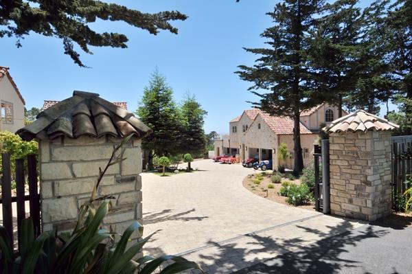 1600 Viscaino Road Pebble Beach, CA 93953 - Photo 3 of 11 a view of a white house with a outdoor space and a tree
