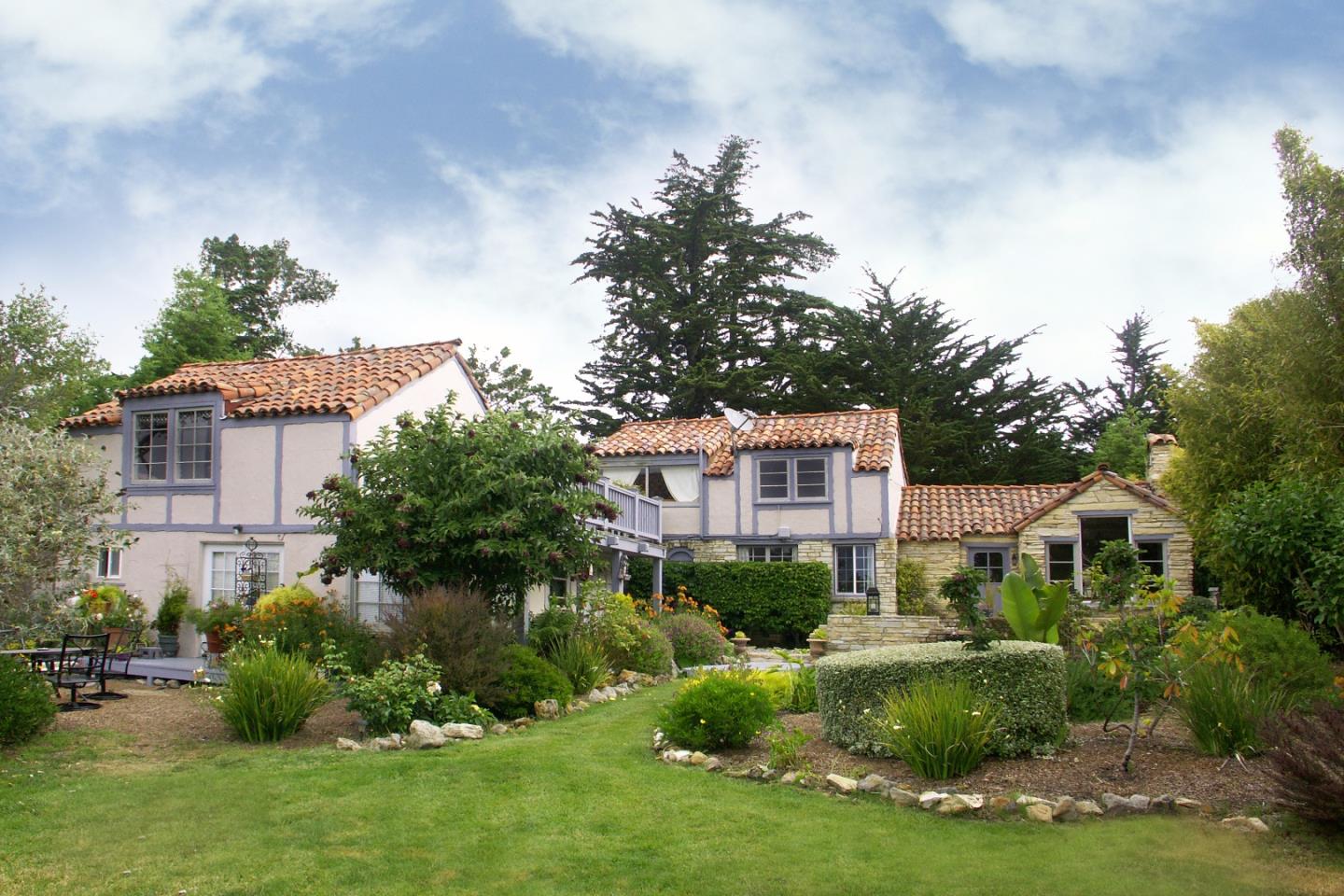 1600 Viscaino Road Pebble Beach, CA 93953 - Photo 4 of 11 a front view of a house with a yard