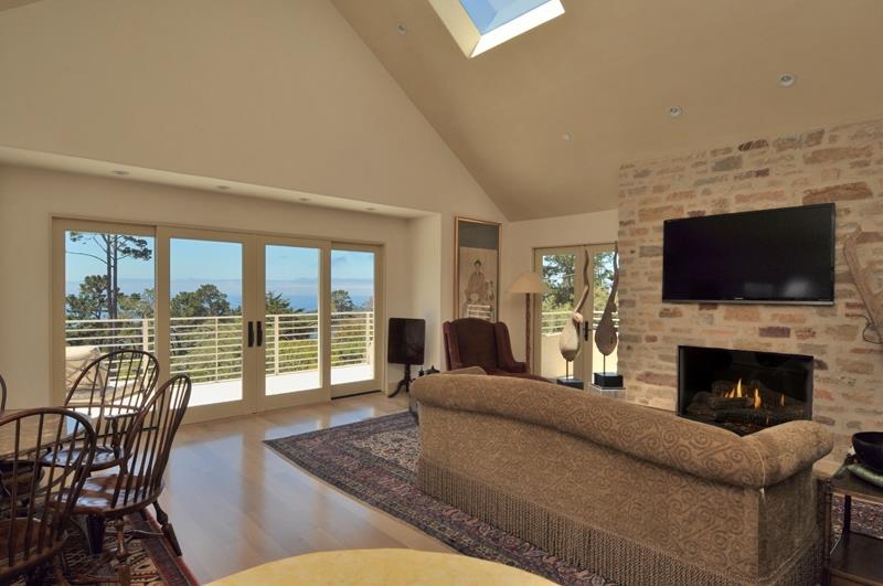 1600 Viscaino Road Pebble Beach, CA 93953 - Photo 7 of 11 a living room with fireplace furniture and a flat screen tv