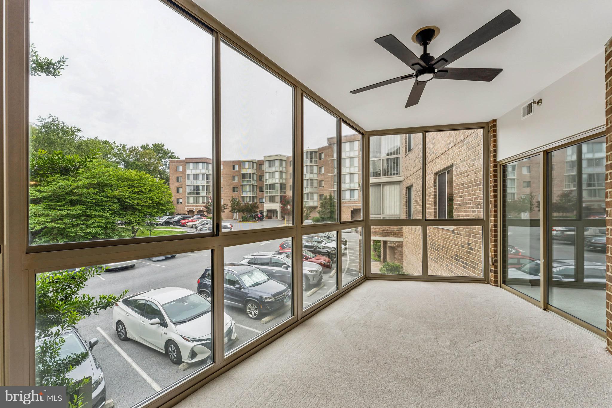 2900 North Leisure World Boulevard, Unit 209 Silver Spring, MD 20906 - Photo 11 of 24 a view of a living room and balcony with furniture