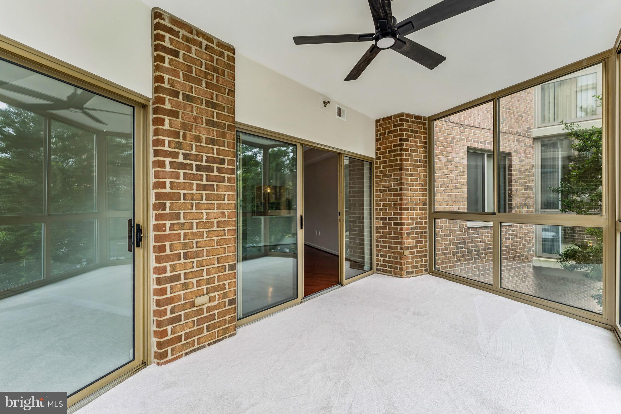 2900 North Leisure World Boulevard, Unit 209 Silver Spring, MD 20906 - Photo 12 of 24 a bedroom with a bed and a chandelier