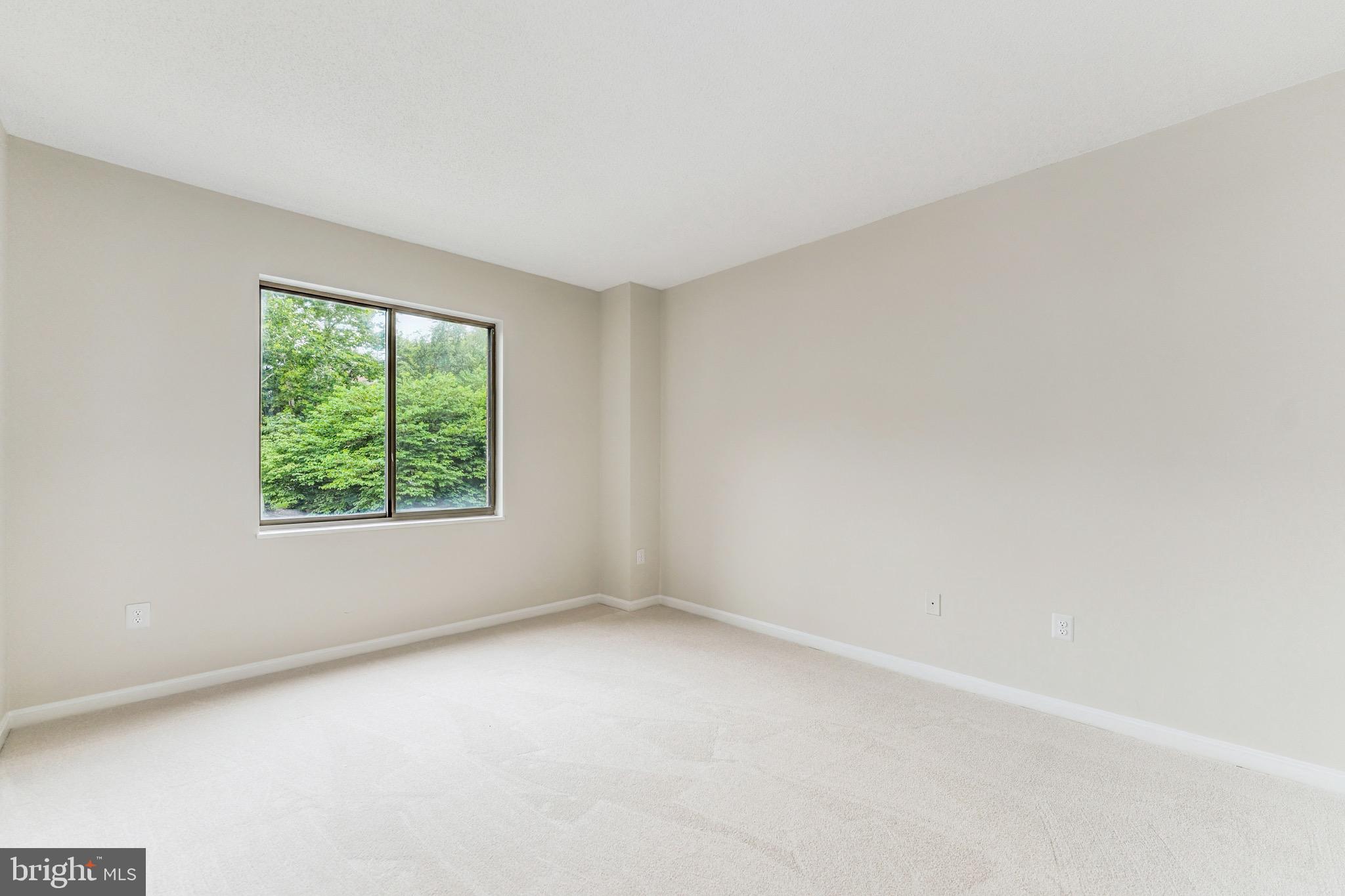 2900 North Leisure World Boulevard, Unit 209 Silver Spring, MD 20906 - Photo 19 of 24 an empty room with windows