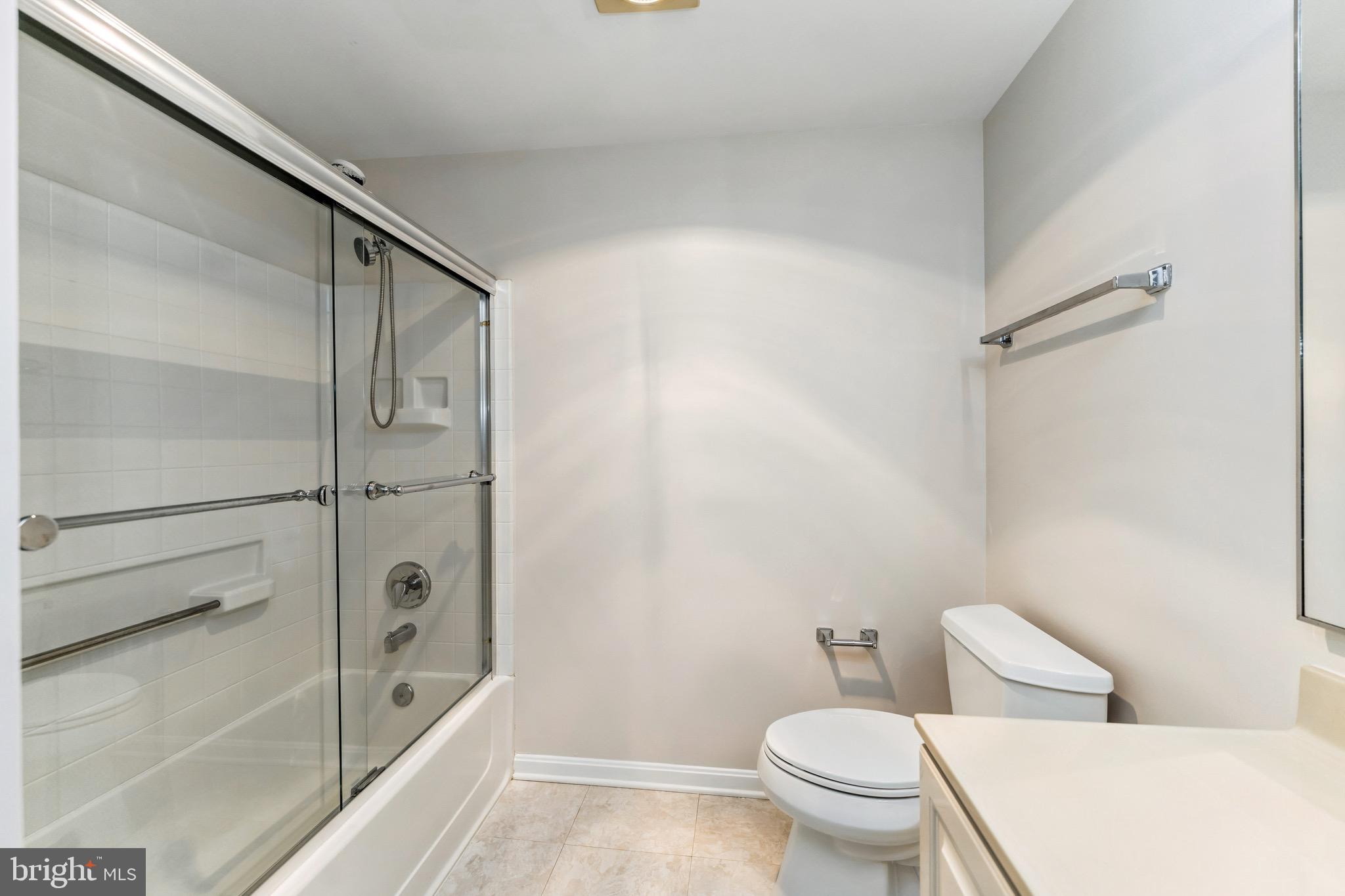 2900 North Leisure World Boulevard, Unit 209 Silver Spring, MD 20906 - Photo 21 of 24 a bathroom with a toilet and a shower