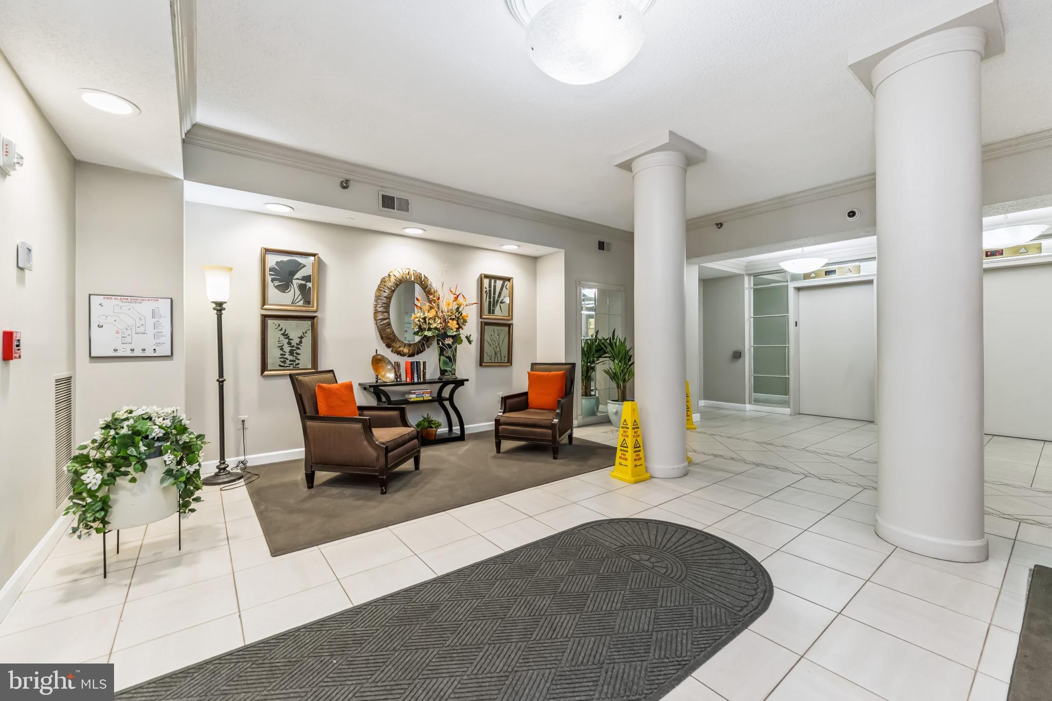 2900 North Leisure World Boulevard, Unit 209 Silver Spring, MD 20906 - Photo 3 of 24 a living room with furniture and a chandelier