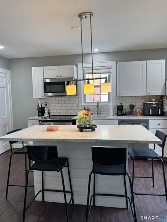 a kitchen with a sink cabinets and window