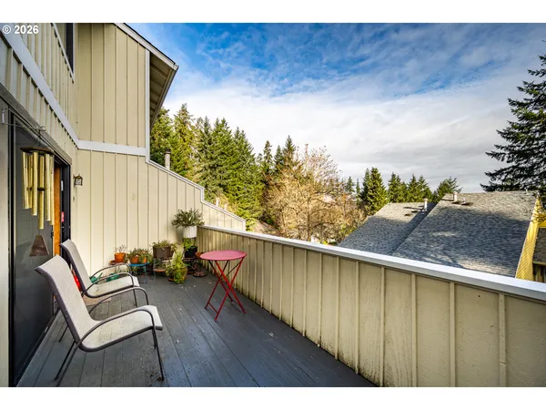 a view of a swimming pool with furniture