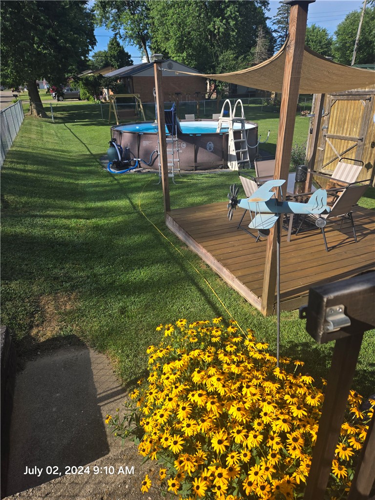 321 Liberty Street Eaton, OH 45320 - Photo 7 of 34 This spacious backyard features an inviting pool, perfect for outdoor enjoyment and relaxation.