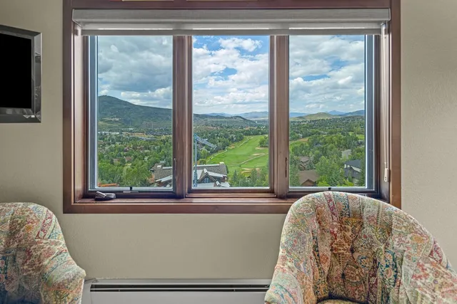 a bedroom with a bed and a night stand