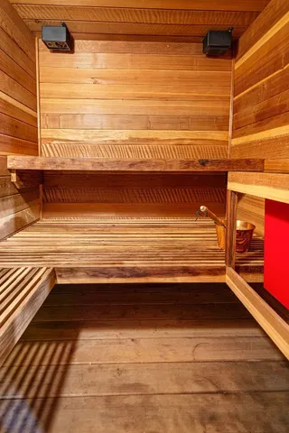 a view of a balcony with floor to ceiling windows and wooden floor