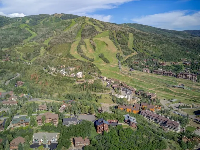 a view of a city with mountains in the background