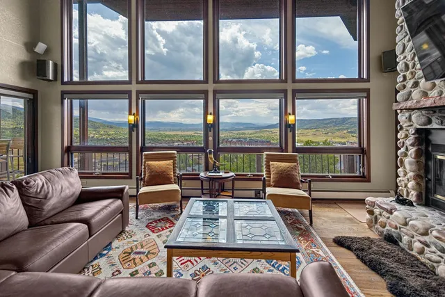 a living room with furniture and a rug