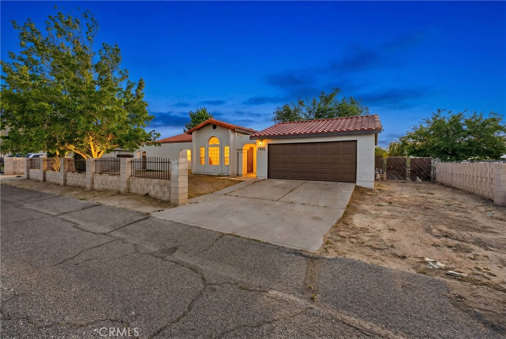40251 Fieldspring Street Palmdale, CA 93591 - Photo 1 of 45 a front view of a house with a yard