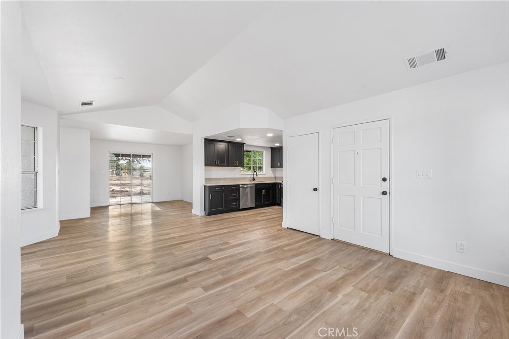 40251 Fieldspring Street Palmdale, CA 93591 - Photo 11 of 45 a view of a kitchen with wooden floor