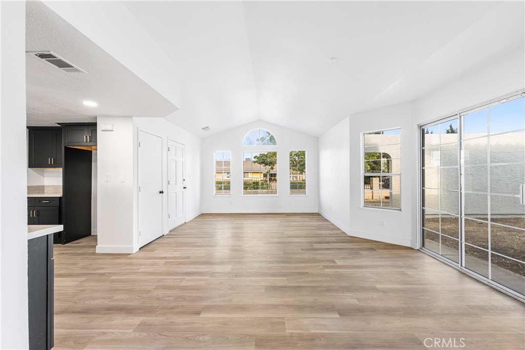 40251 Fieldspring Street Palmdale, CA 93591 - Photo 12 of 45 an empty room with wooden floor and windows