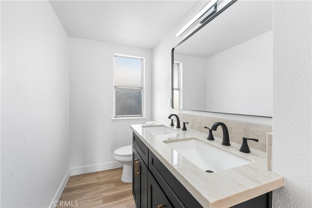 40251 Fieldspring Street Palmdale, CA 93591 - Photo 28 of 45 a bathroom with a sink and a toilet