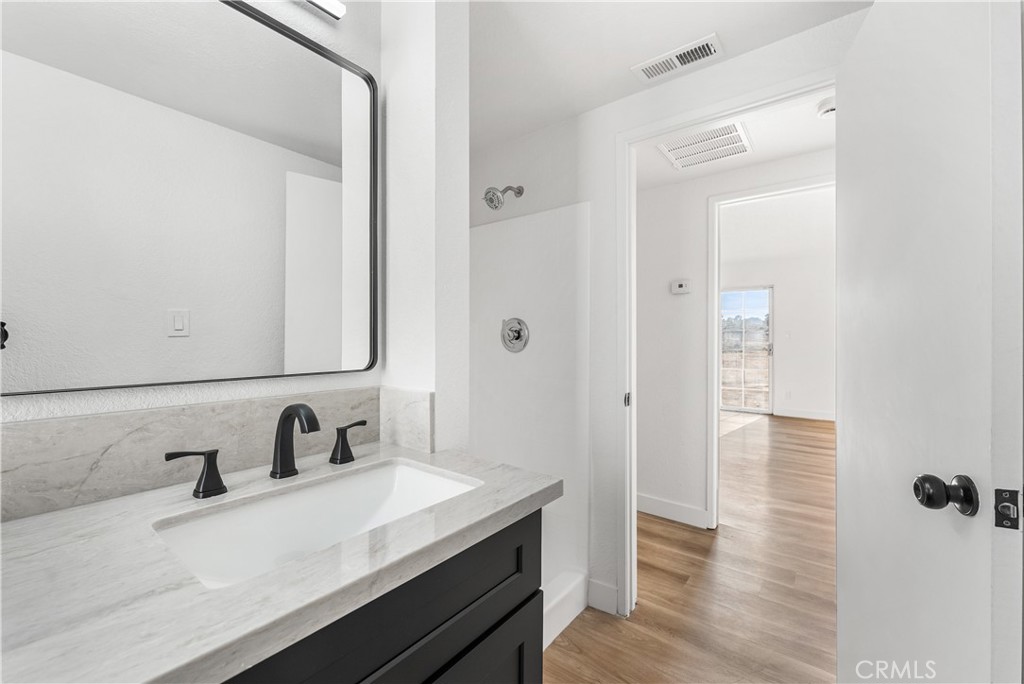 40251 Fieldspring Street Palmdale, CA 93591 - Photo 29 of 45 a bathroom with a sink and a mirror