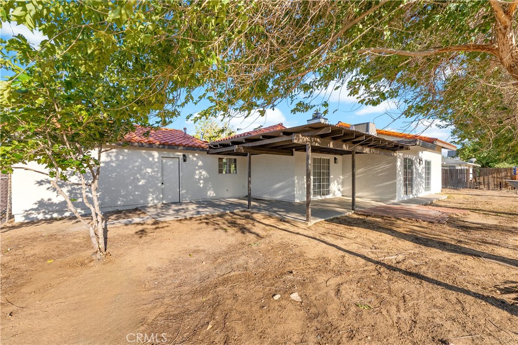 40251 Fieldspring Street Palmdale, CA 93591 - Photo 38 of 45 a front view of a house with a yard and garage