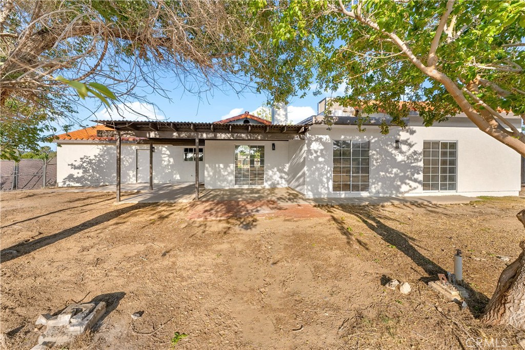 40251 Fieldspring Street Palmdale, CA 93591 - Photo 39 of 45 a front view of a house with a yard