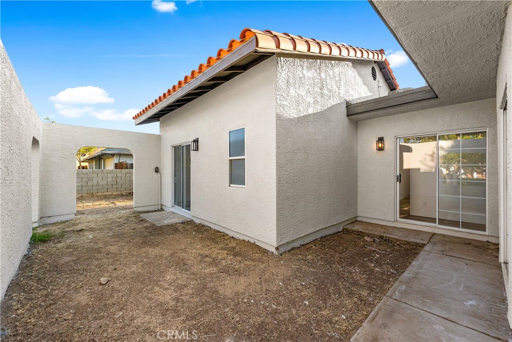 40251 Fieldspring Street Palmdale, CA 93591 - Photo 9 of 45 a view of a house with a backyard