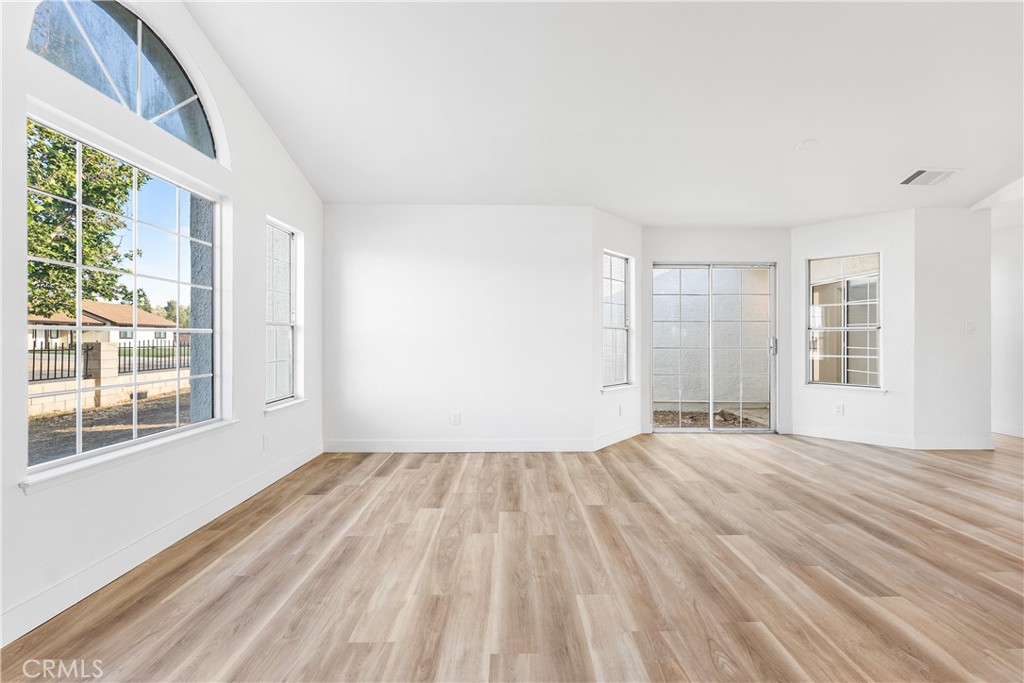40251 Fieldspring Street Palmdale, CA 93591 - Photo 10 of 45 a view of empty room with wooden floor and fan