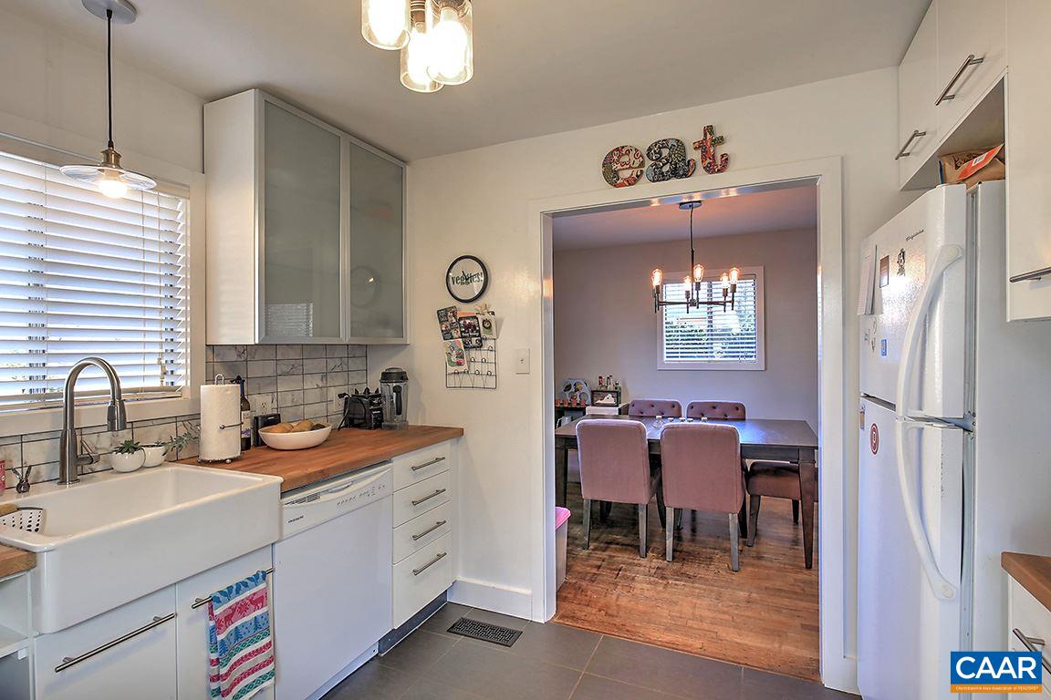 402 Harris Road Charlottesville, VA 22903 - Photo 14 of 17 a kitchen with a refrigerator sink and cabinets
