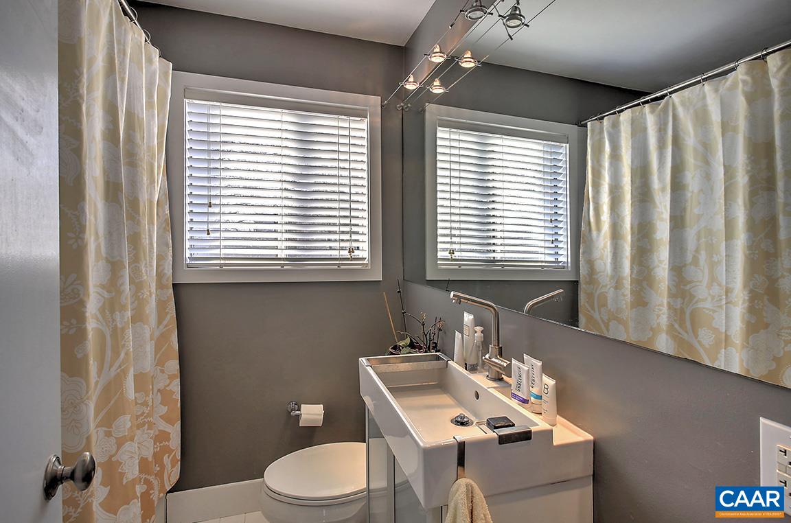 402 Harris Road Charlottesville, VA 22903 - Photo 15 of 17 a bathroom with a sink vanity mirror and toilet