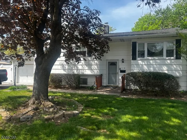a view of a house with backyard porch and sitting area