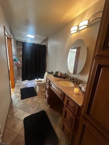 a bathroom with a double vanity sink and mirror